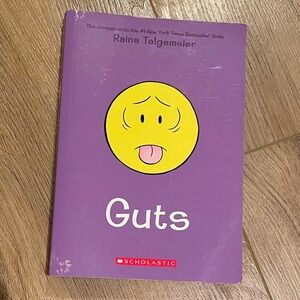 Scholastic Purple Book with Yellow Face